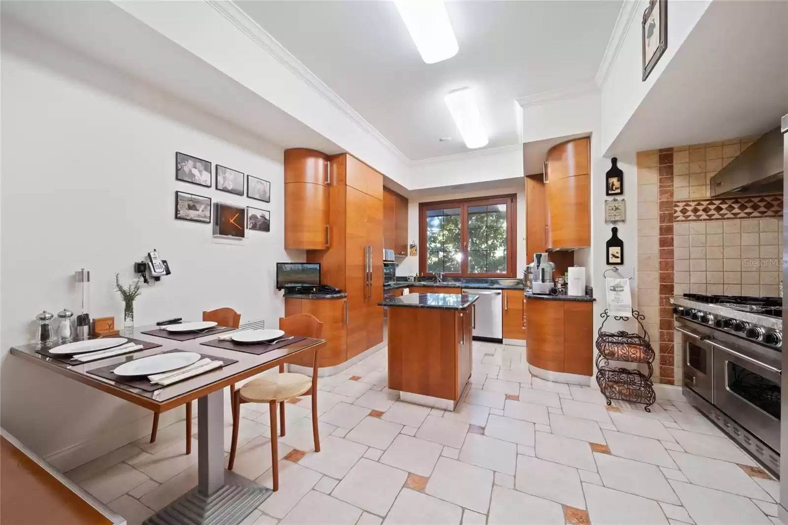 The home is equipped with an additional Chef's kitchen with commercial-grade appliances, set up with access to the main dinning room through the butler's pantry, ideal for entertaining guests