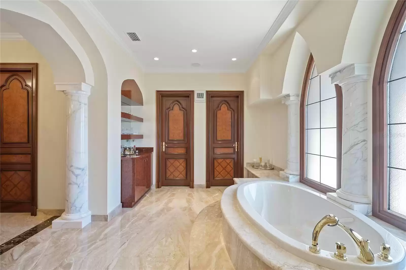 His and hers water closets each complete with its own bidet.