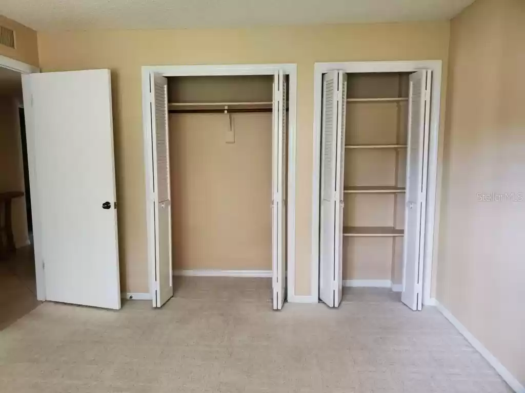 Bedroom 3, located on back side of condo, overlooking entryway and parking areas.