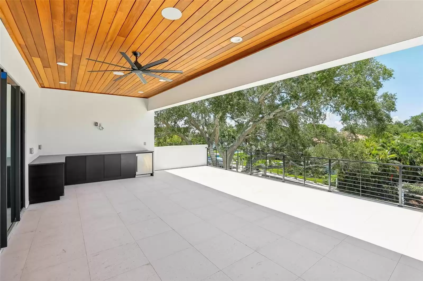 Off TV/lounge area kitchen and covered lanai