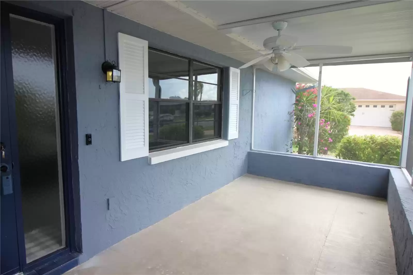 Front of home covered screened patio