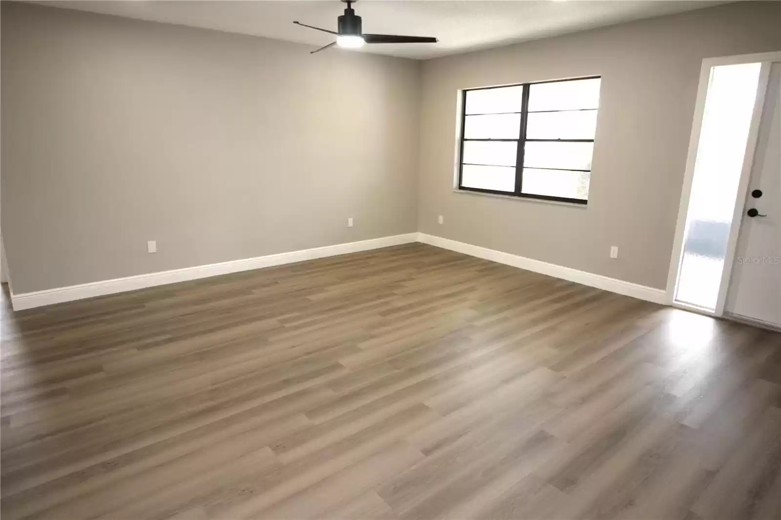 Living room,,,note new 5 1/4 inch baseboards throughout the home