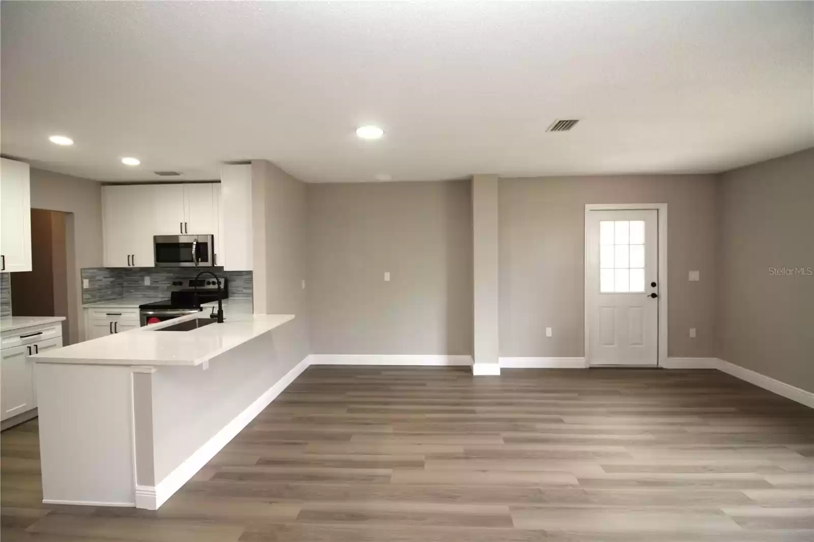 Family room....door at left leads to rear covered patio