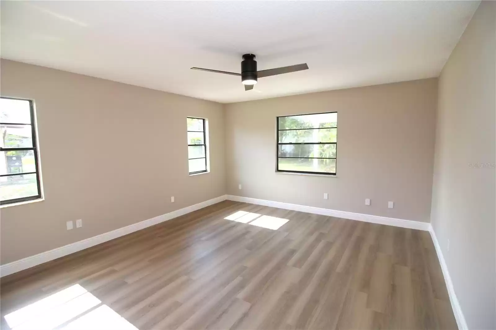 Primary bedroom located at left rear of home