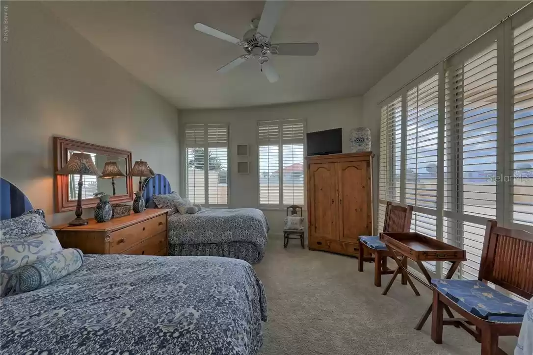 Guest bedroom is light and bright.  Has armoire closet.