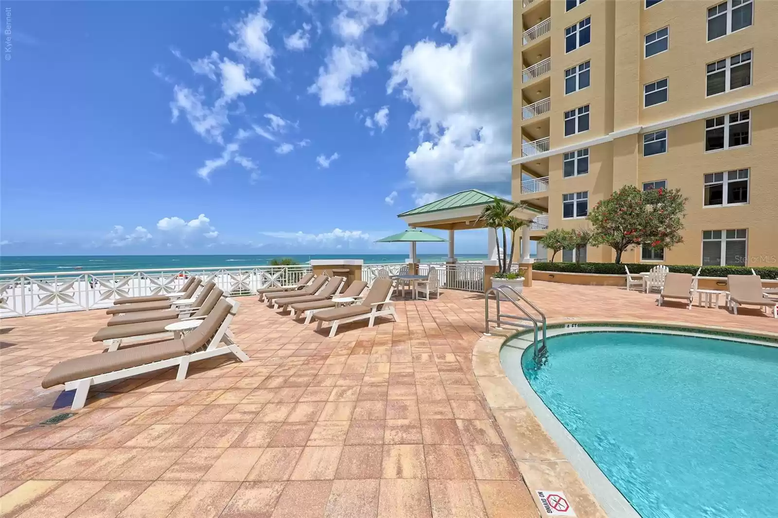 Expansive pool deck with gulf views