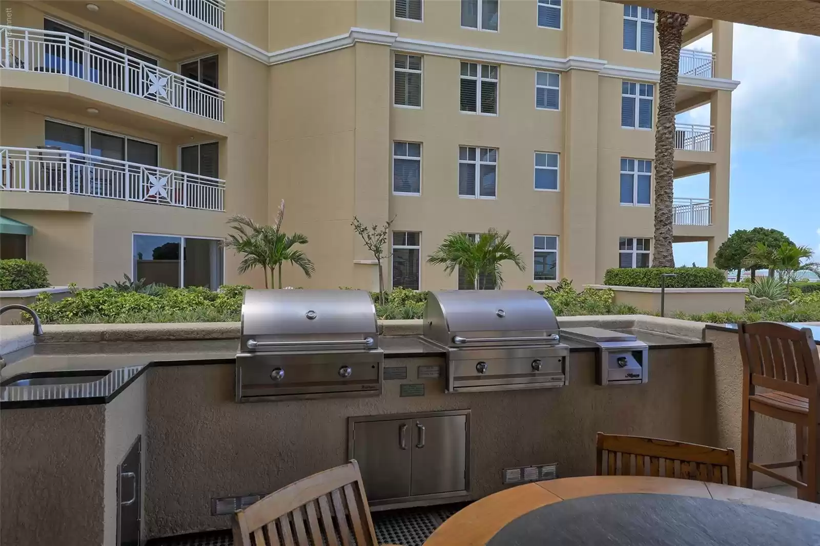 Grill area for resident use by clubhouse & pool