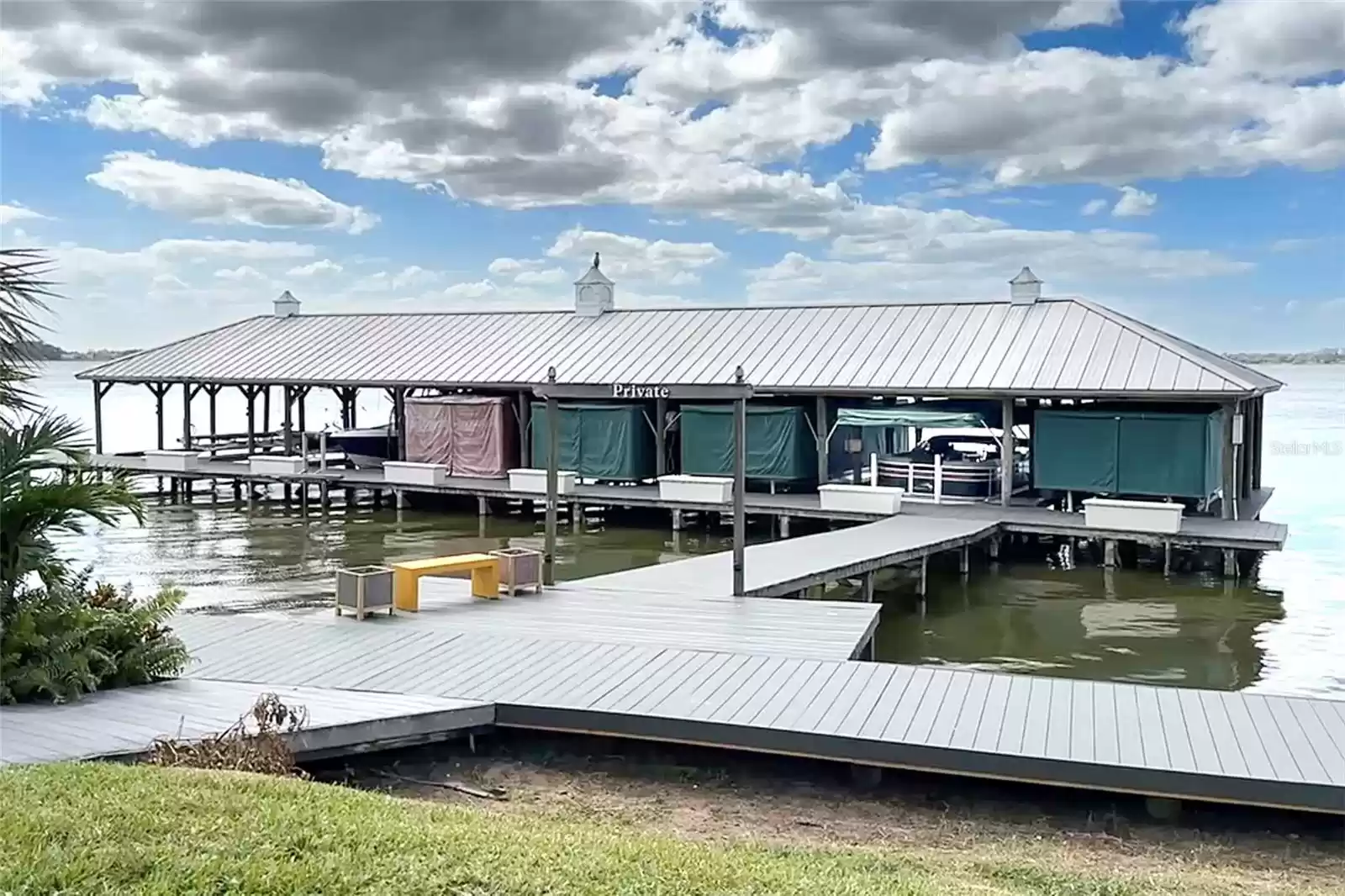 Dock w covered slip included. Water and electric at slip.