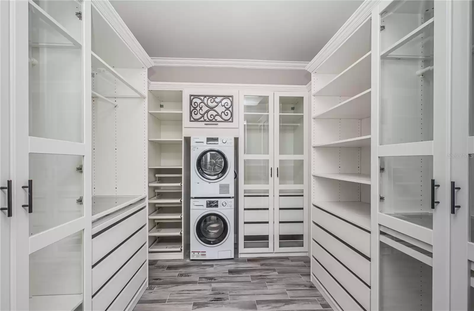 master closet with separate washer/drywer