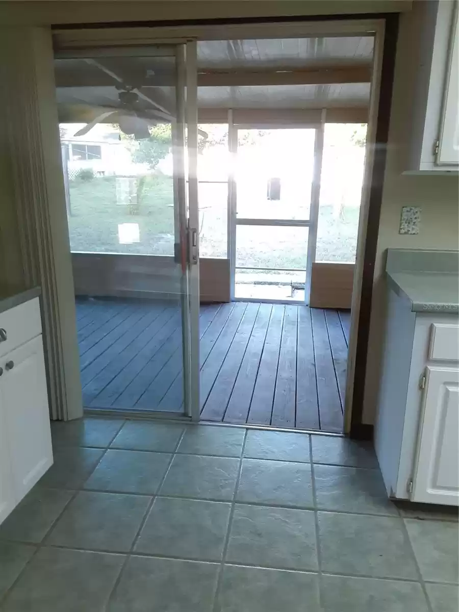 sliding door to enclosed rear porch