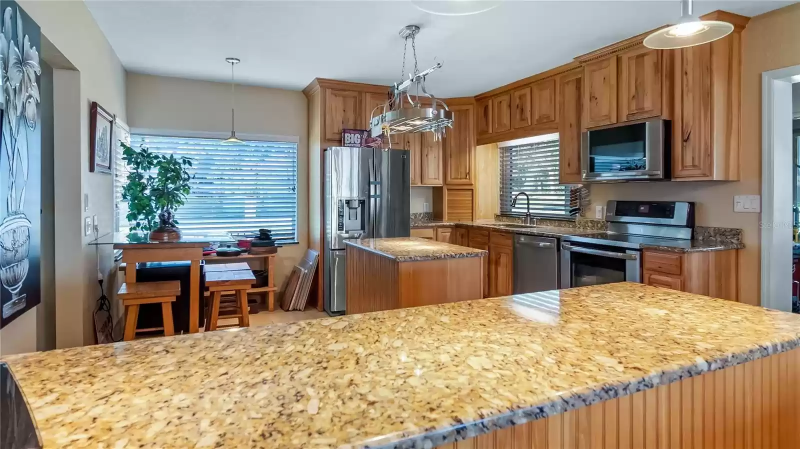 Corner Dinette in Kitchen remodeled 2008ish, hickory cabinets and granite counters