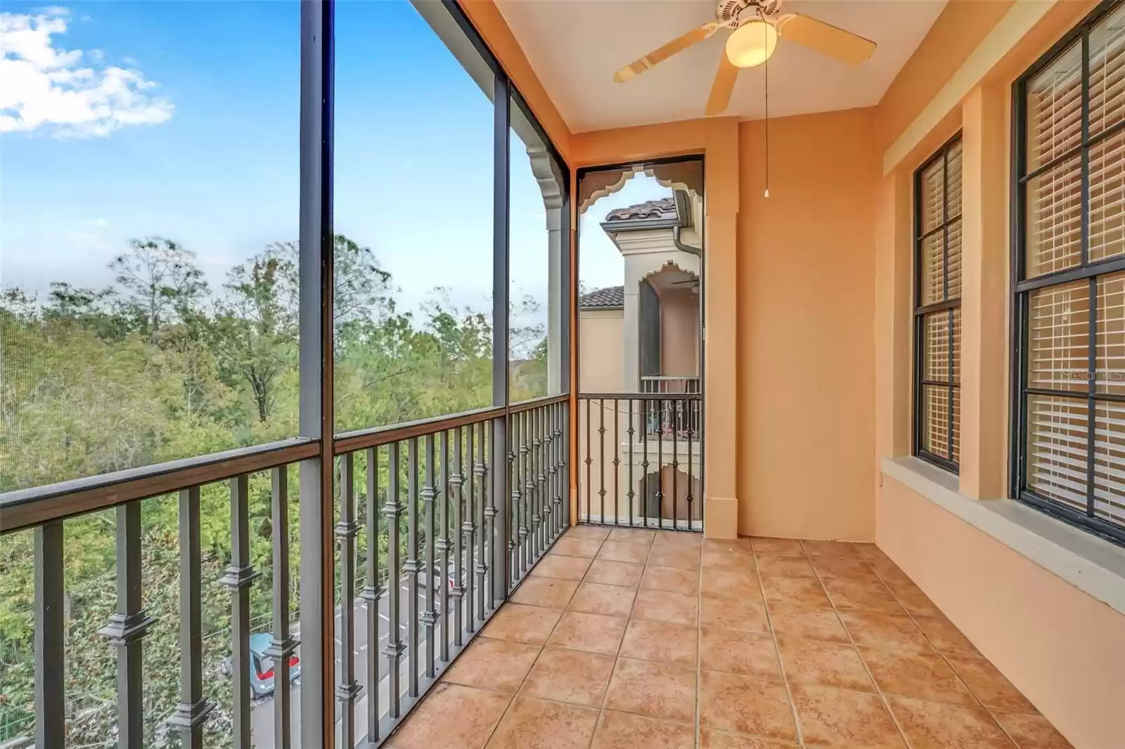 Screened Patio Overlooking Nature Preserve with Tile Floor