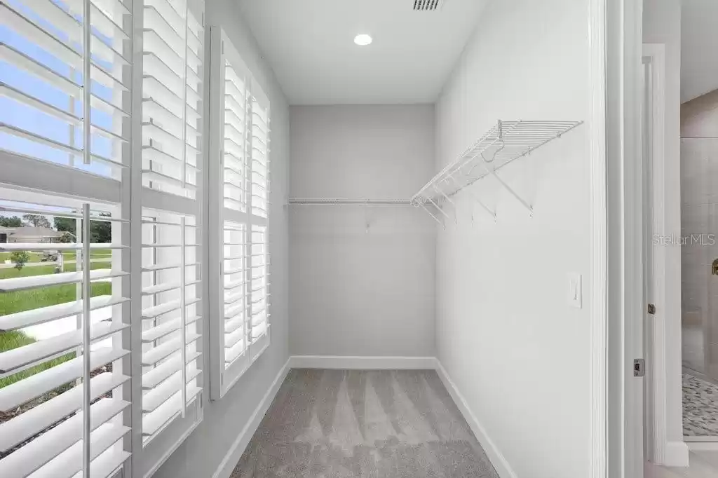 Secondary Walk-in Closet with Shutters