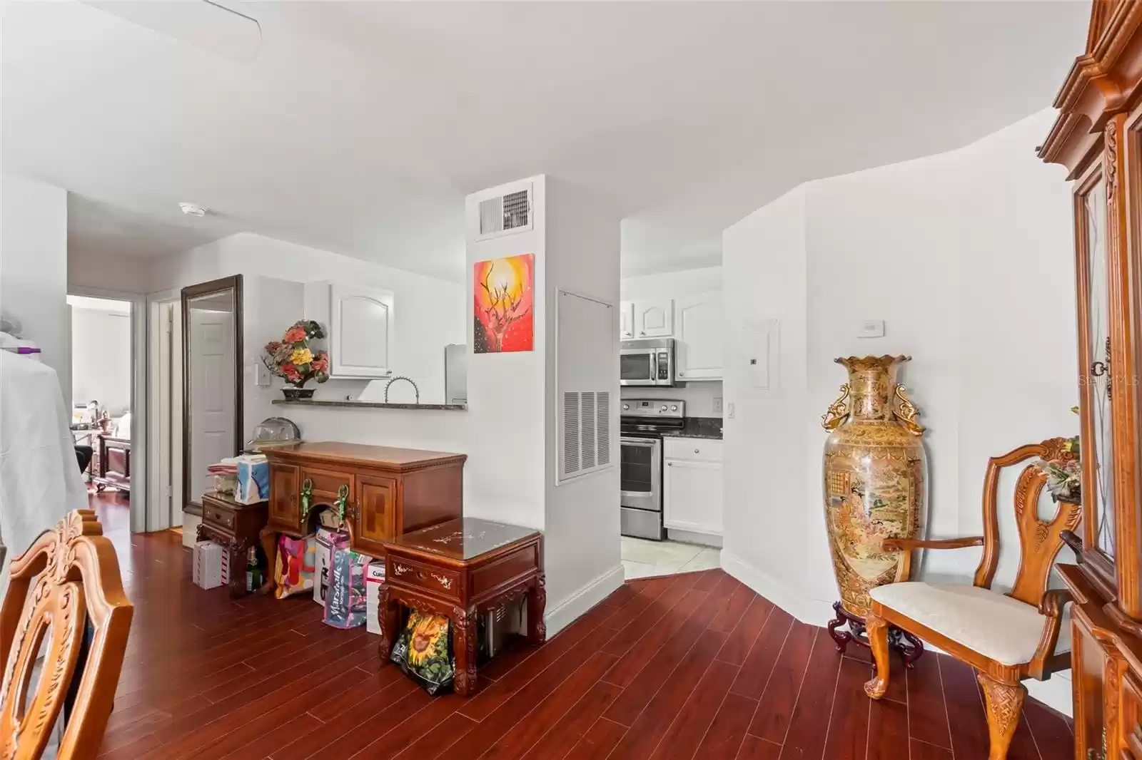 Condo has a Split Floor Plan with Breakfast Bar Opening to the Kitchen and Hall Leading to the Second Bath and  Second and Third Bedrooms