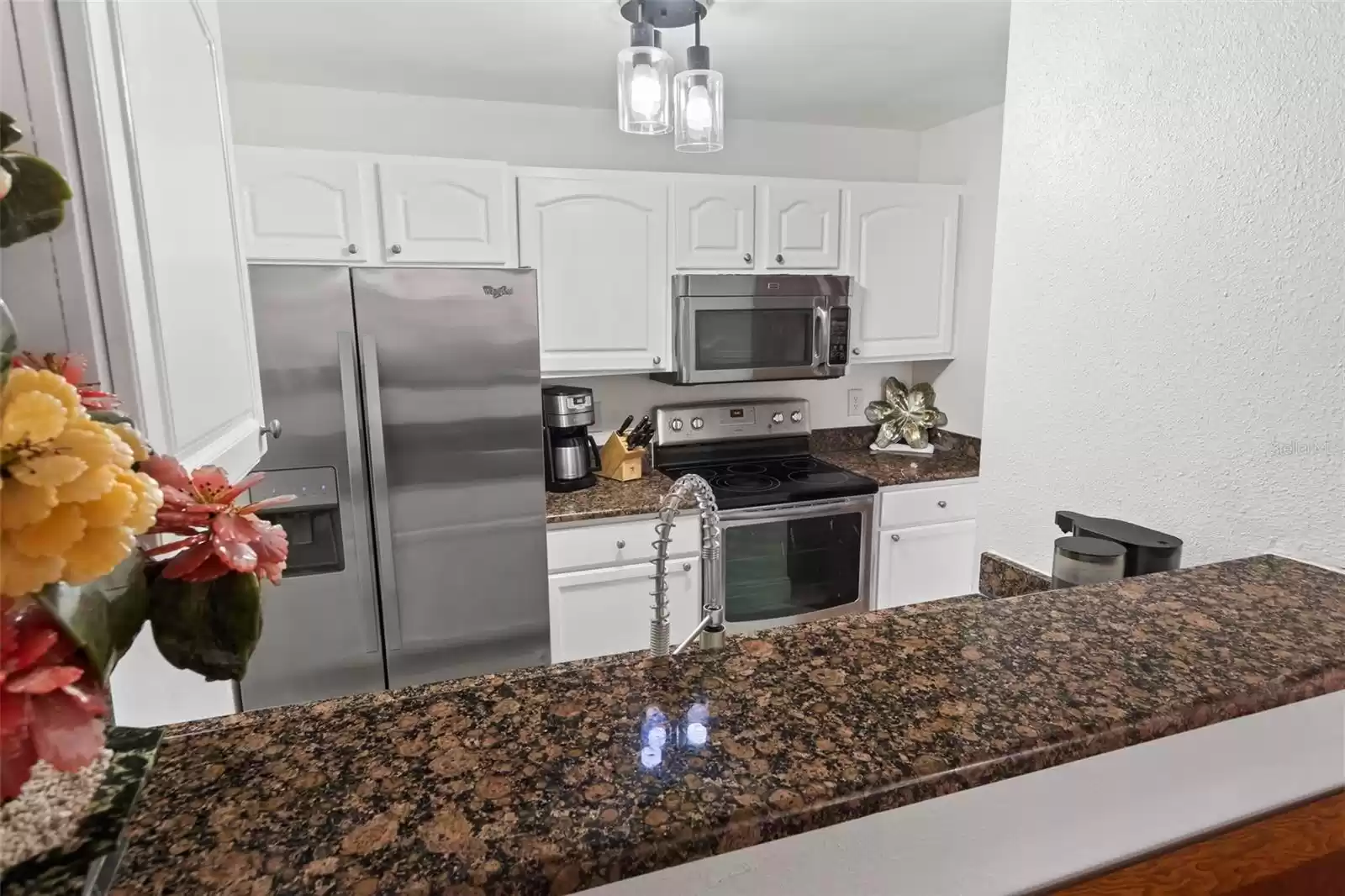 Kitchen with Granite Breakfast Bar, Opens to Living/Dining 