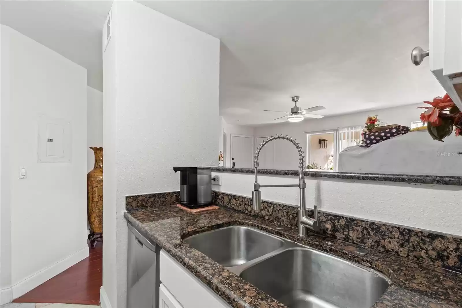 Deeper Double Stainless Sink with Recently Installed Sleek, Industrial-grade Stainless Single Handle Pull-down Flynt Faucet.