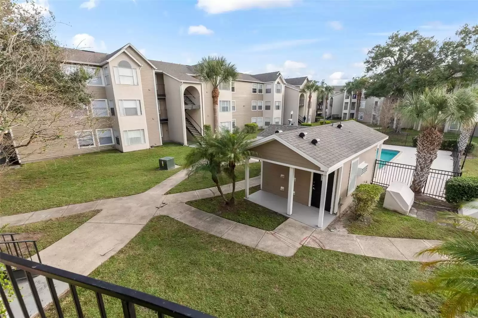 Relax on the Covered Balcony with a View of One of the Sparkling Community Pools