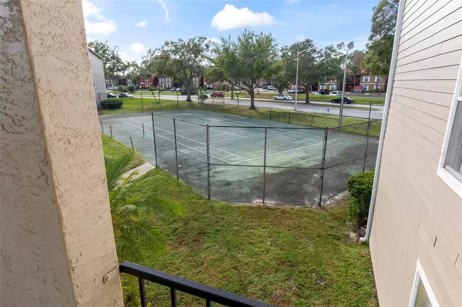 Side View from Covered Balcony of the Community Tennis Courts