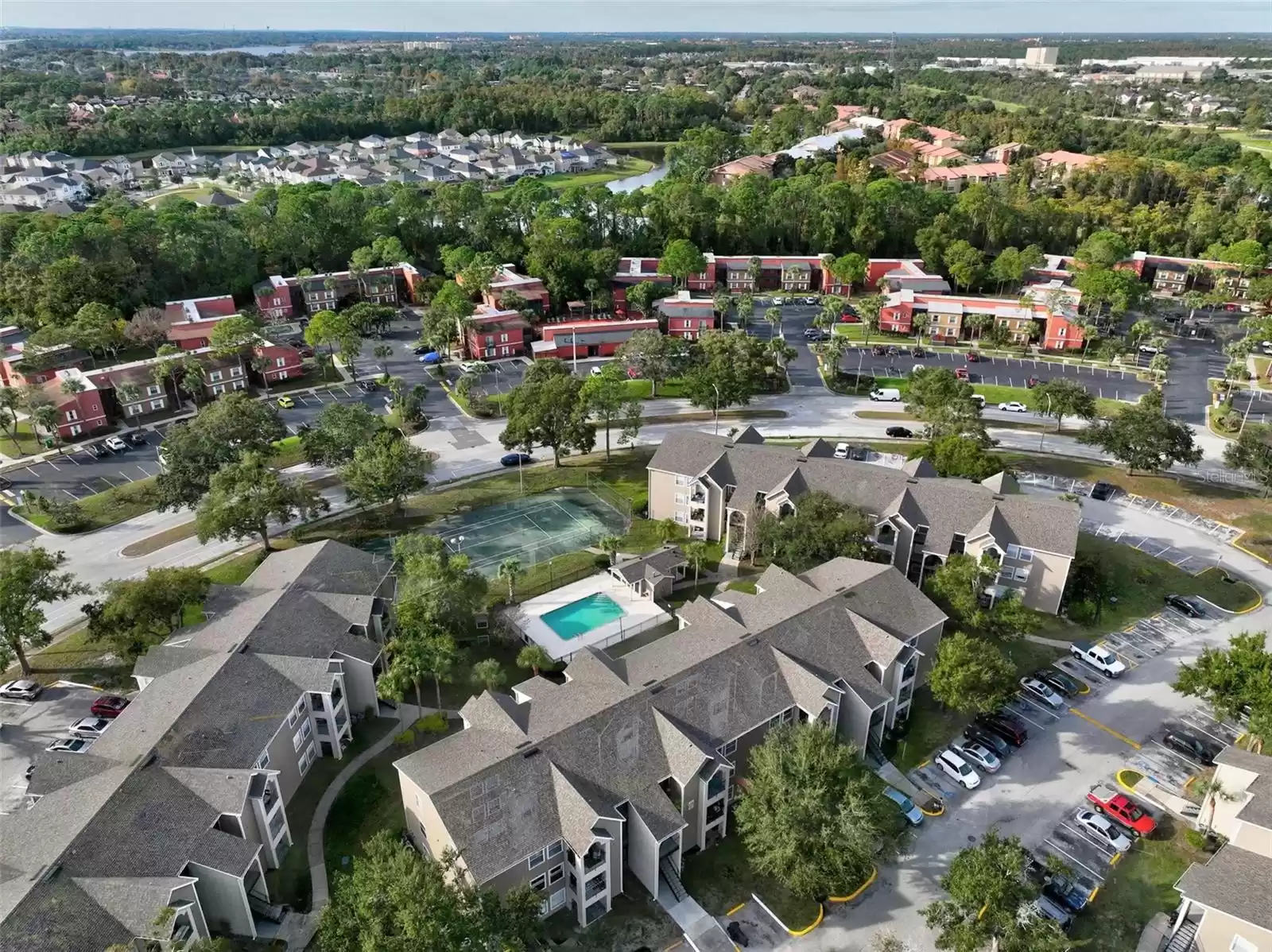 Aerial View Showing the Backside of Building 14 (Top Right) and Condo on the Second Level, End Unit that Overlooks a Community Pool and Tennis Court