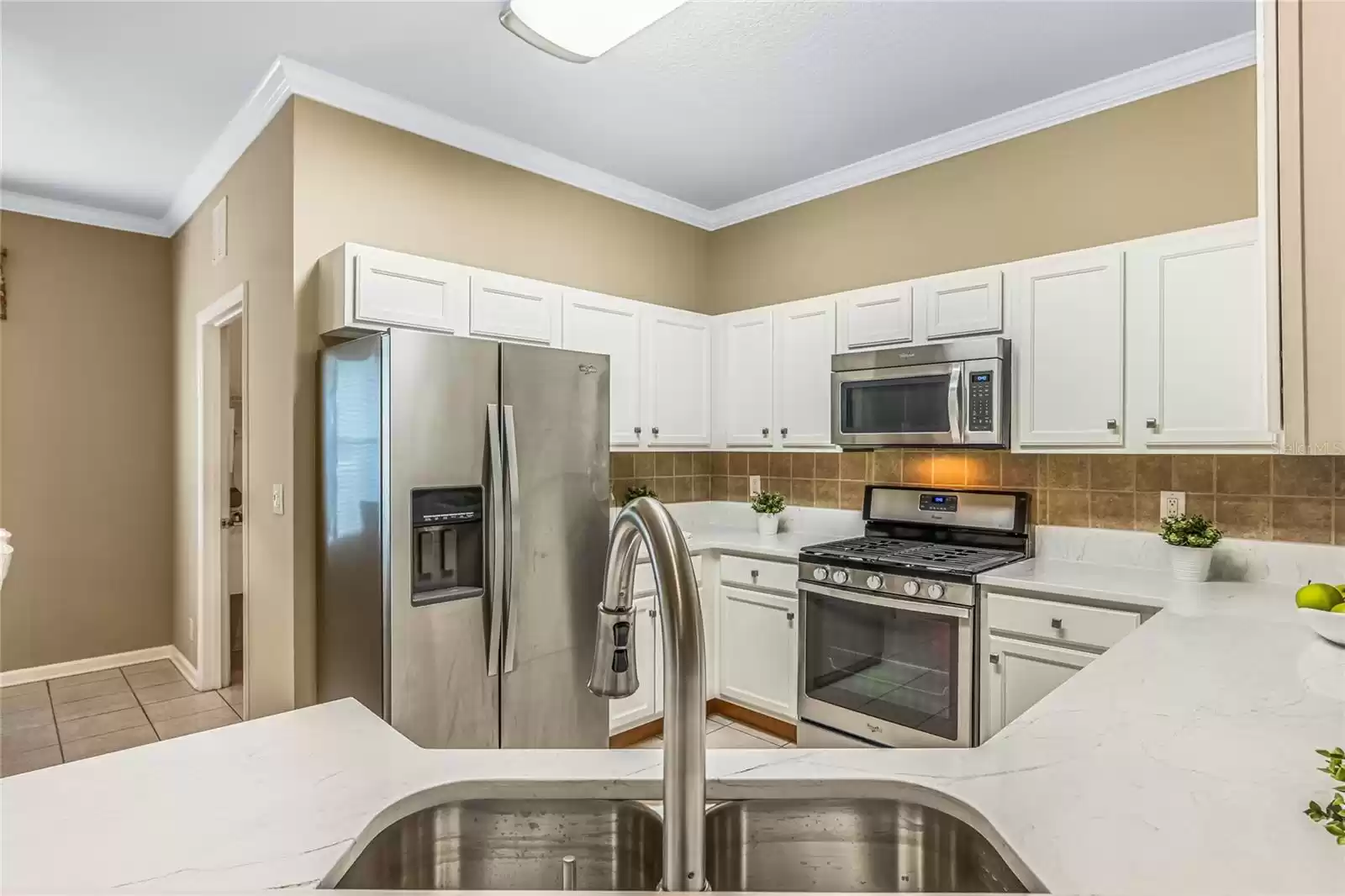 View of Kitchen w/ new Quartz countertops, stainless steel sink & kitchen faucet