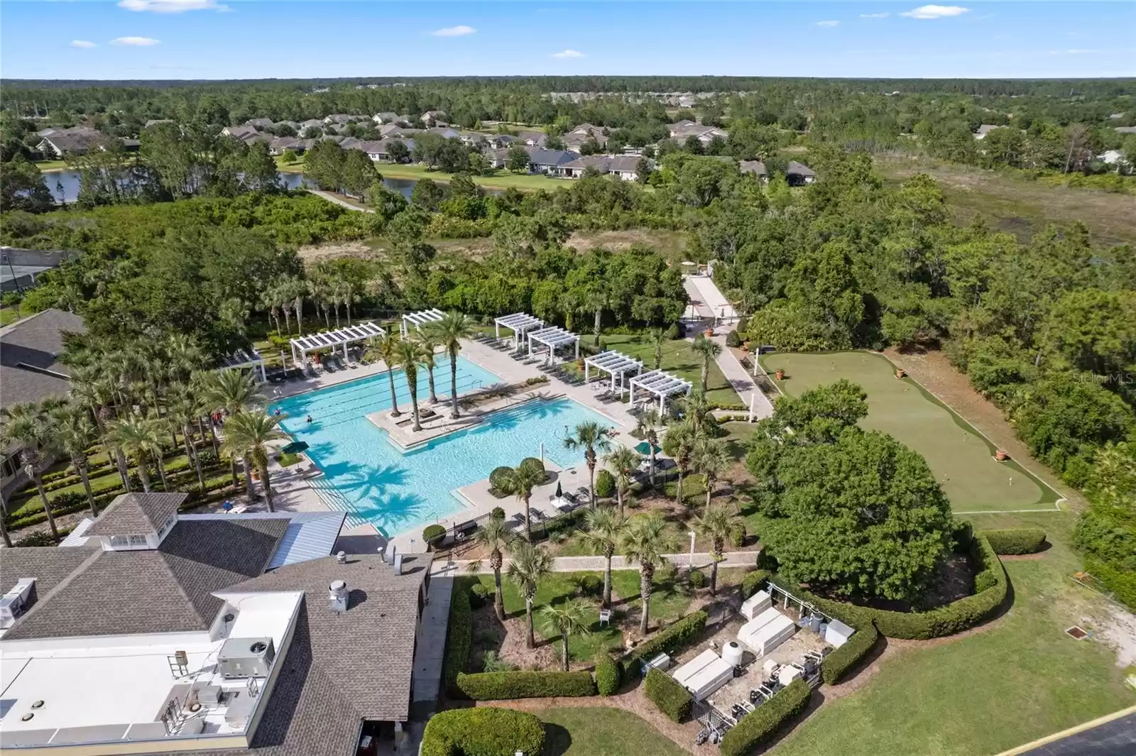 Aerial view of the Victoria Gardens resort style heated pool, putting green & bocce ball courts