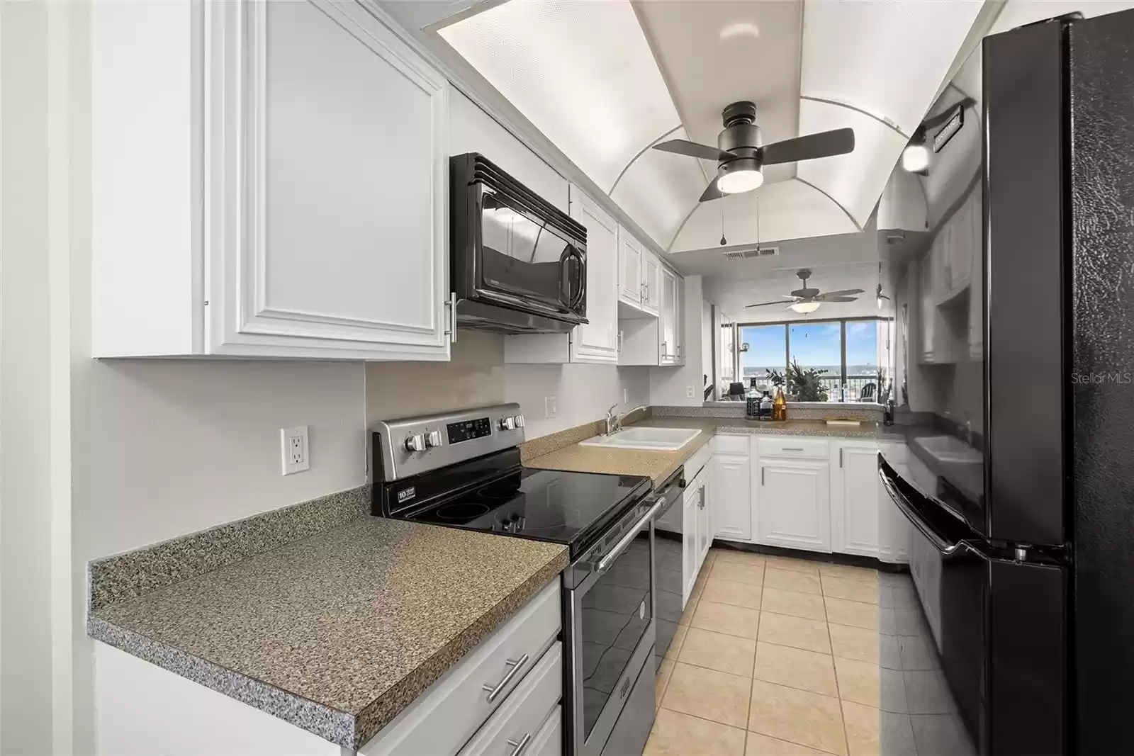 Neutral tones in this kitchen with open floor plan