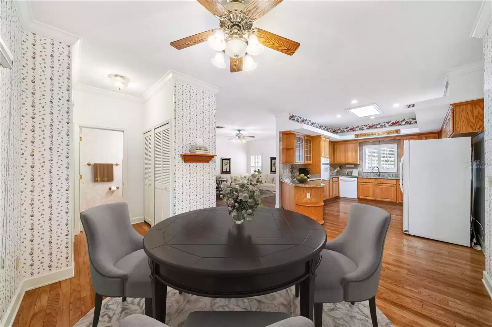 Casual dining area virtually staged adjacent to the kitchen.