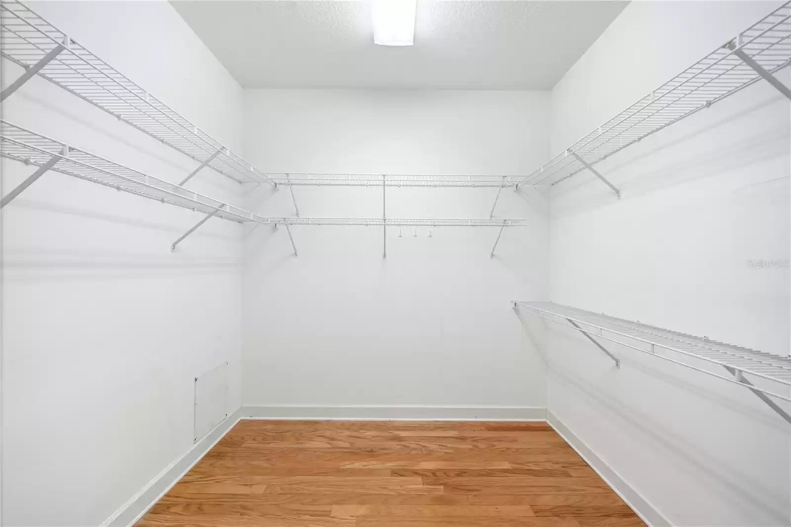 Primary bedroom walk-in closet.