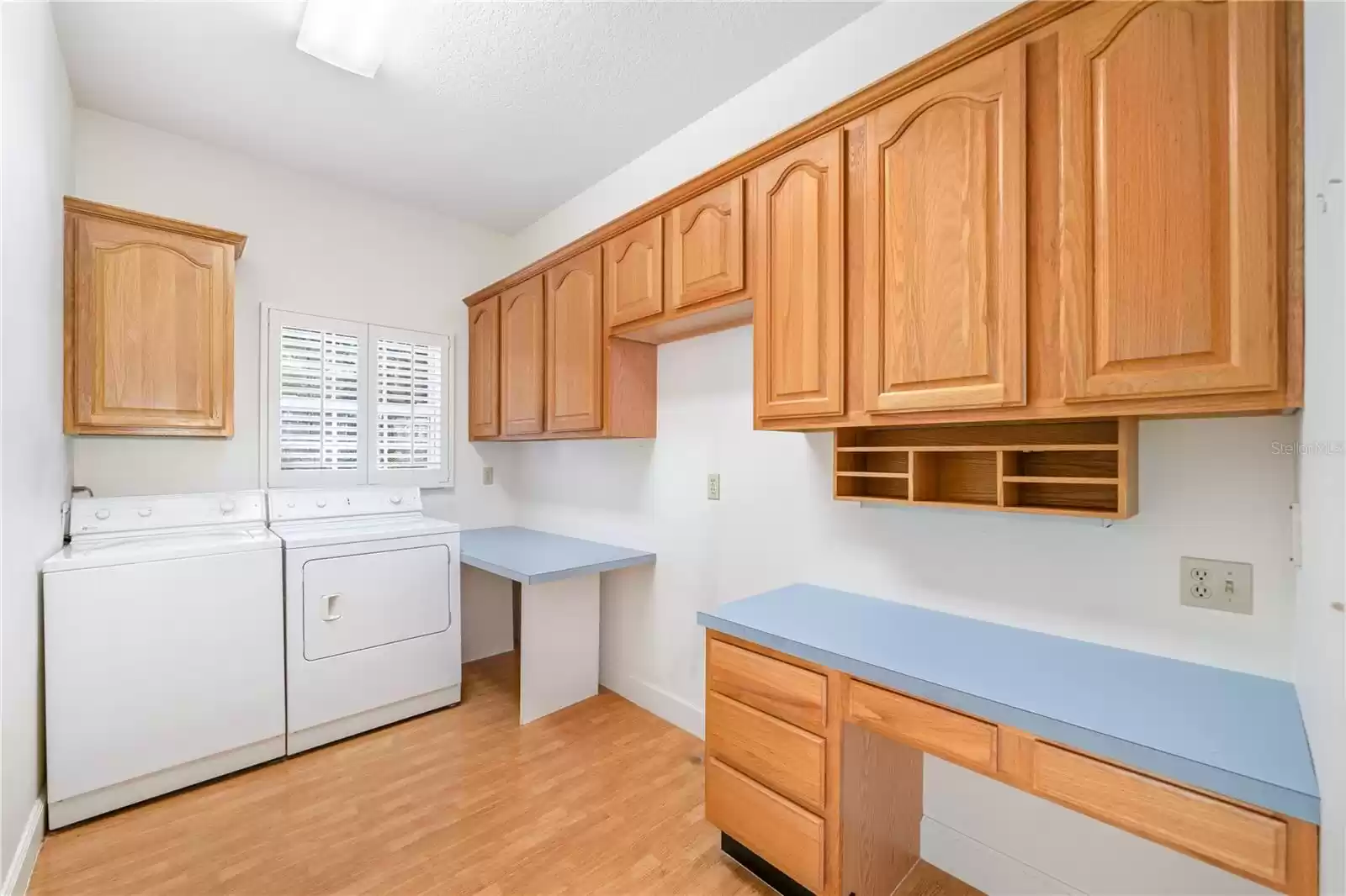 Indoor laundry with ample storage.