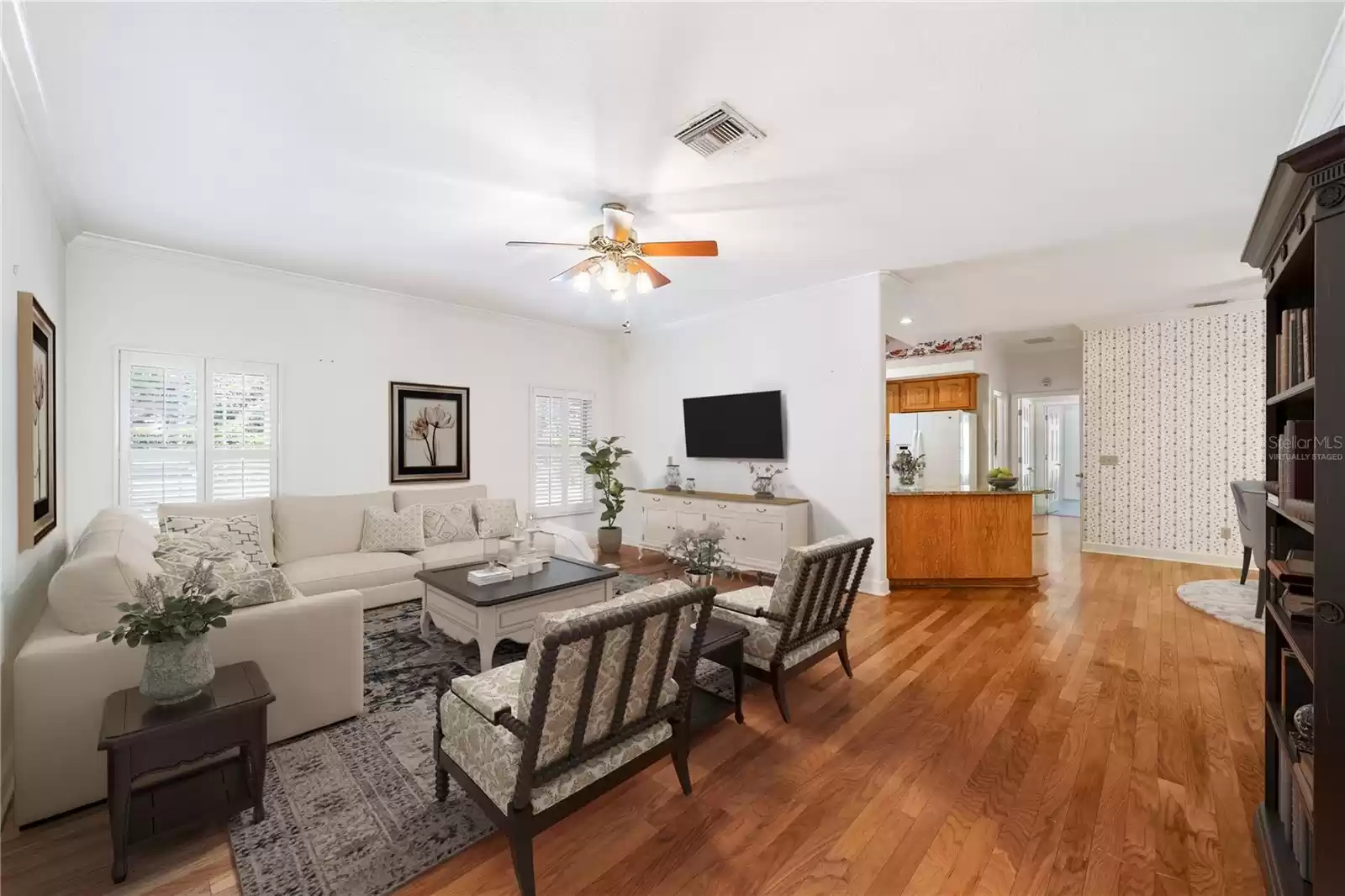 Family room virtually staged with easy access to the kitchen.