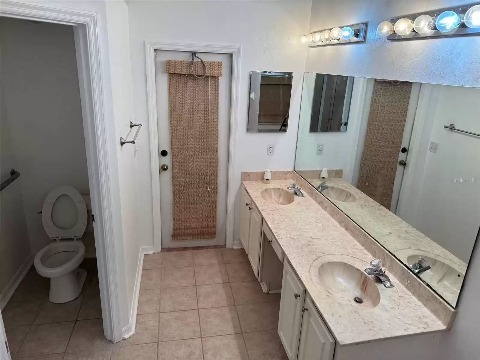 Master Bath- Double Vanity,Private Toilet area, Door to Screened Patio