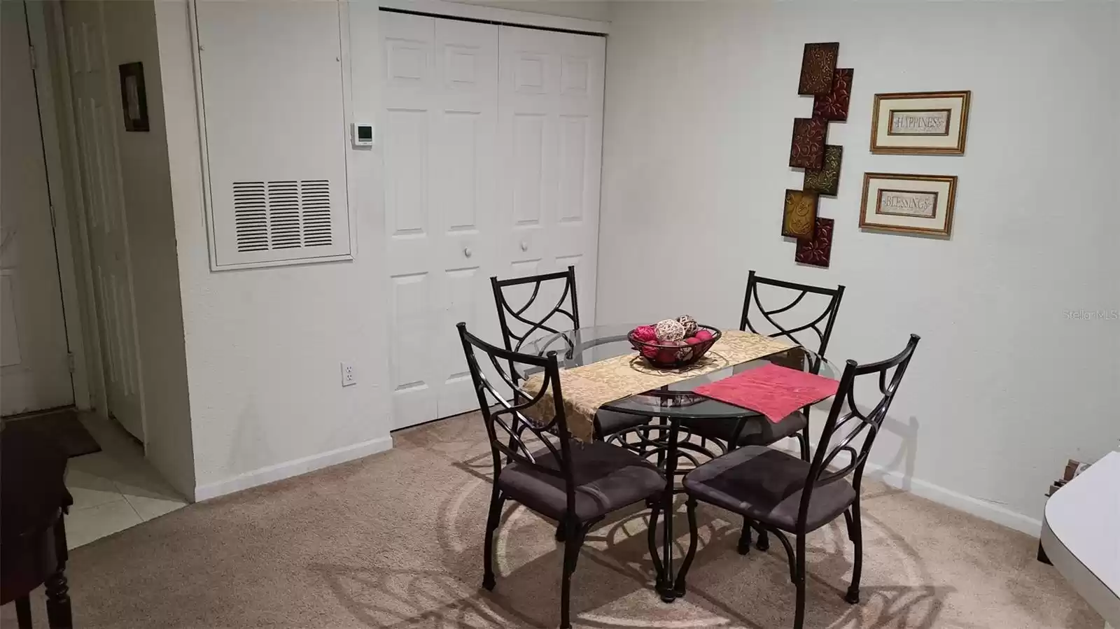 Dinner area.  Washer and dryer closet behind.