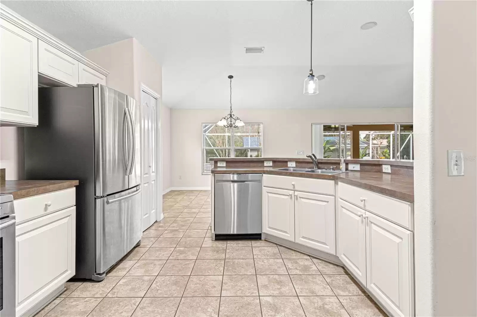 Large kitchen with stainless steel appliances