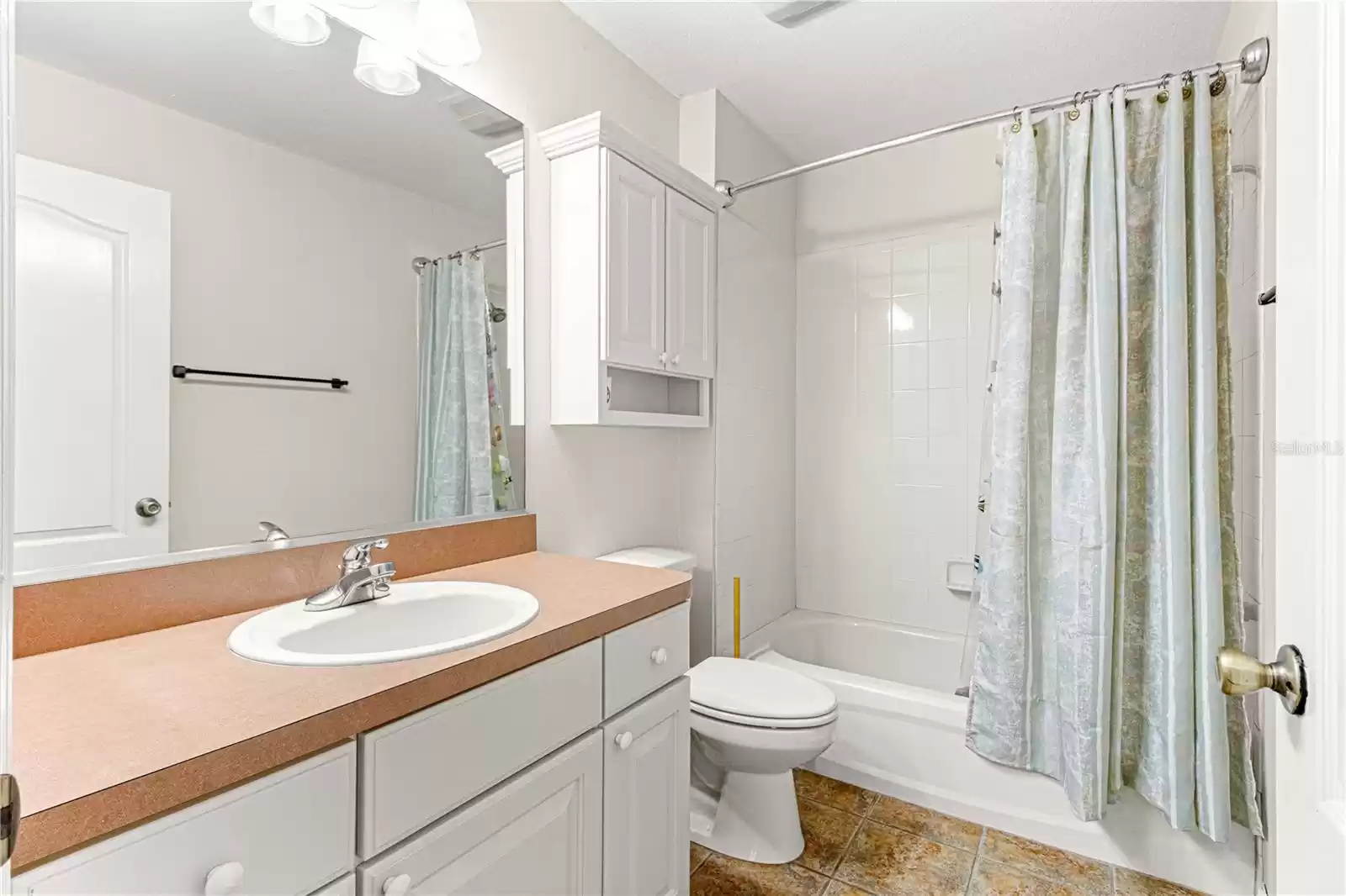 Nice size guest bathroom with tub