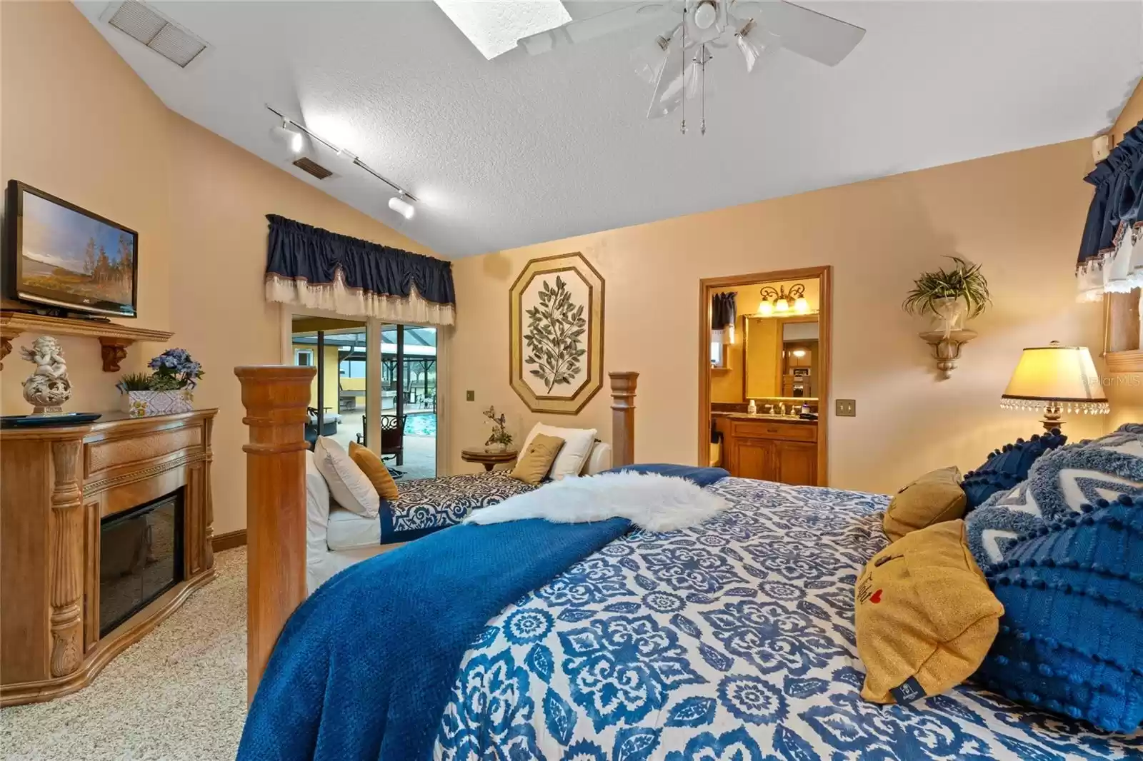 Back EnSuite Bedroom with Fireplace and Sliding Doors to Pool/Patio