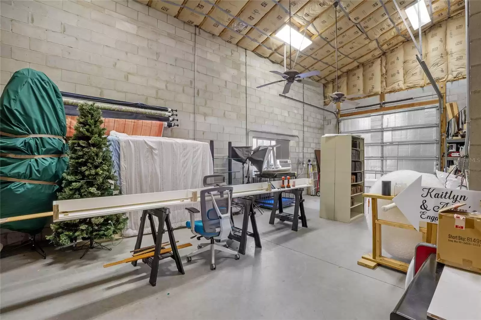 Storage Room in Back of Garage with Roll up Door