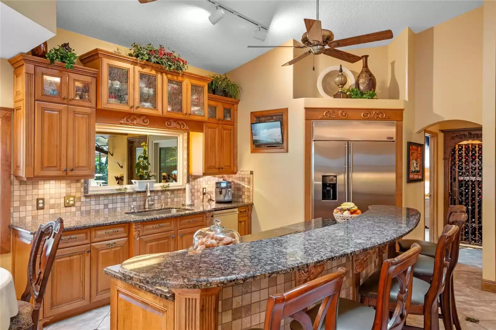 Kitchen Bar toward Sink with window toward Pool