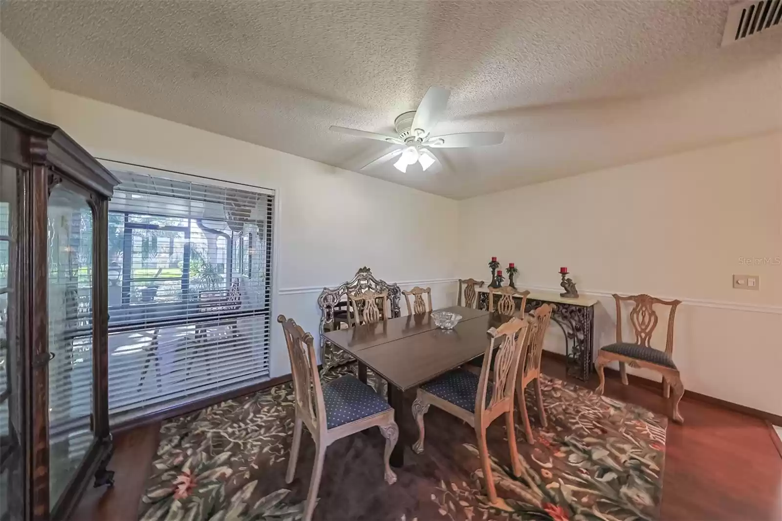 Dining Room has an oversized window which looks onto the lanai and the entire front yard.  It makes the room feel open and bright.