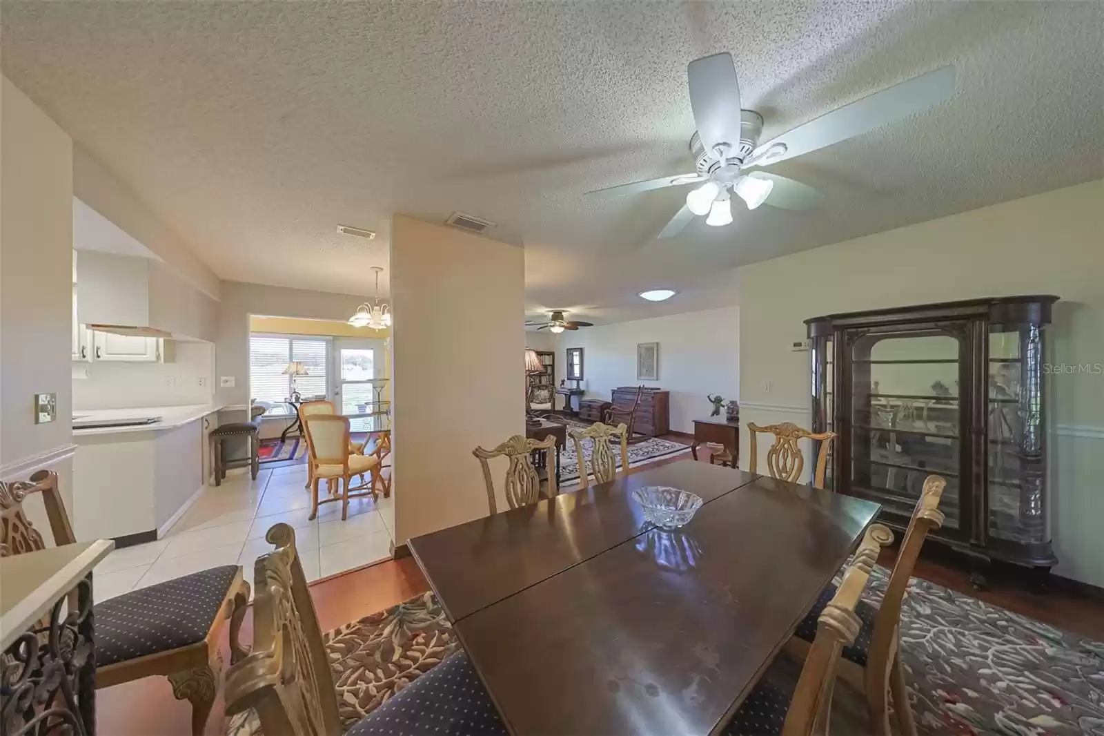 Dining room offers a cozy space for private dinners or playing cards with friends.  Easy access to the kitchen makes for perfect entertaining opportunities and includes a ceiling fan with light.