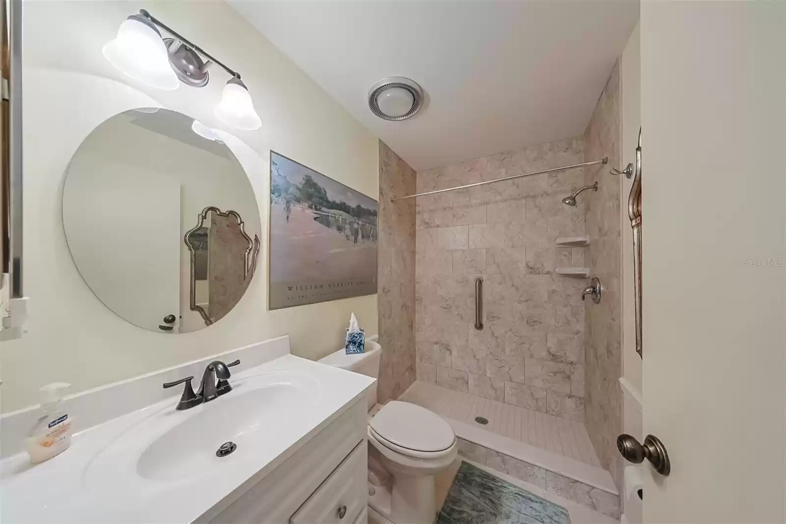 Guest Bathroom has been updated with large walk-in shower (notice the grab bar handle for safety and low entry to walk in with ease) granite counters and tons of lighting to primp for a night out on the town.