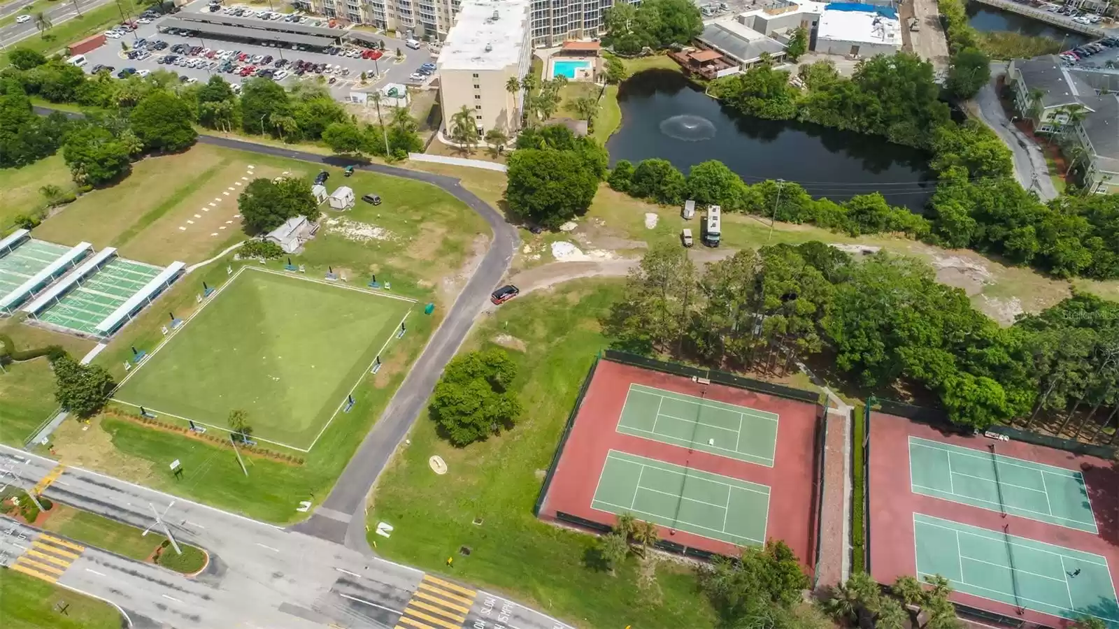 Enjoy a game of tennis, lawn bowling or shuffleboard with friends at the community tennis courts.