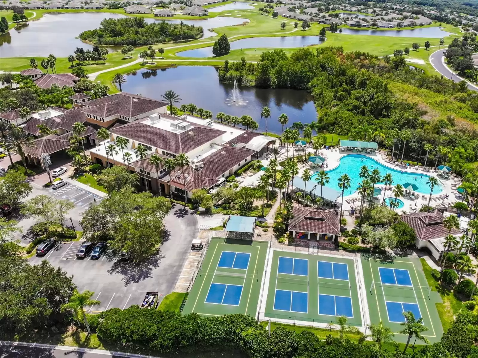 Community view of the South Club House with pool, pickleball and volleyball courts.