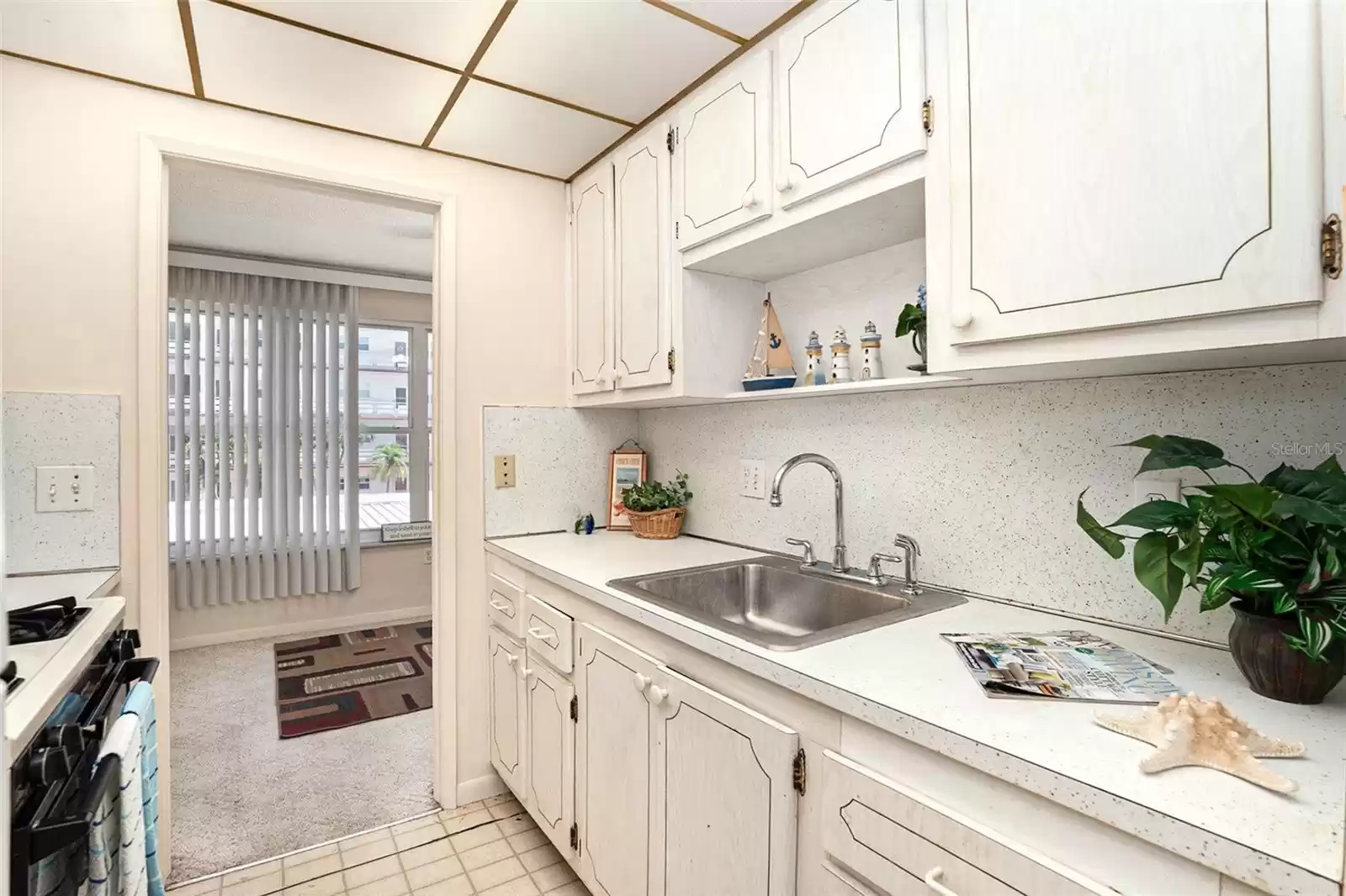 Kitchen leads to sunroom!