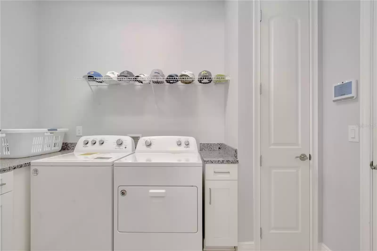 Laundry room upgraded with cabinets and sink