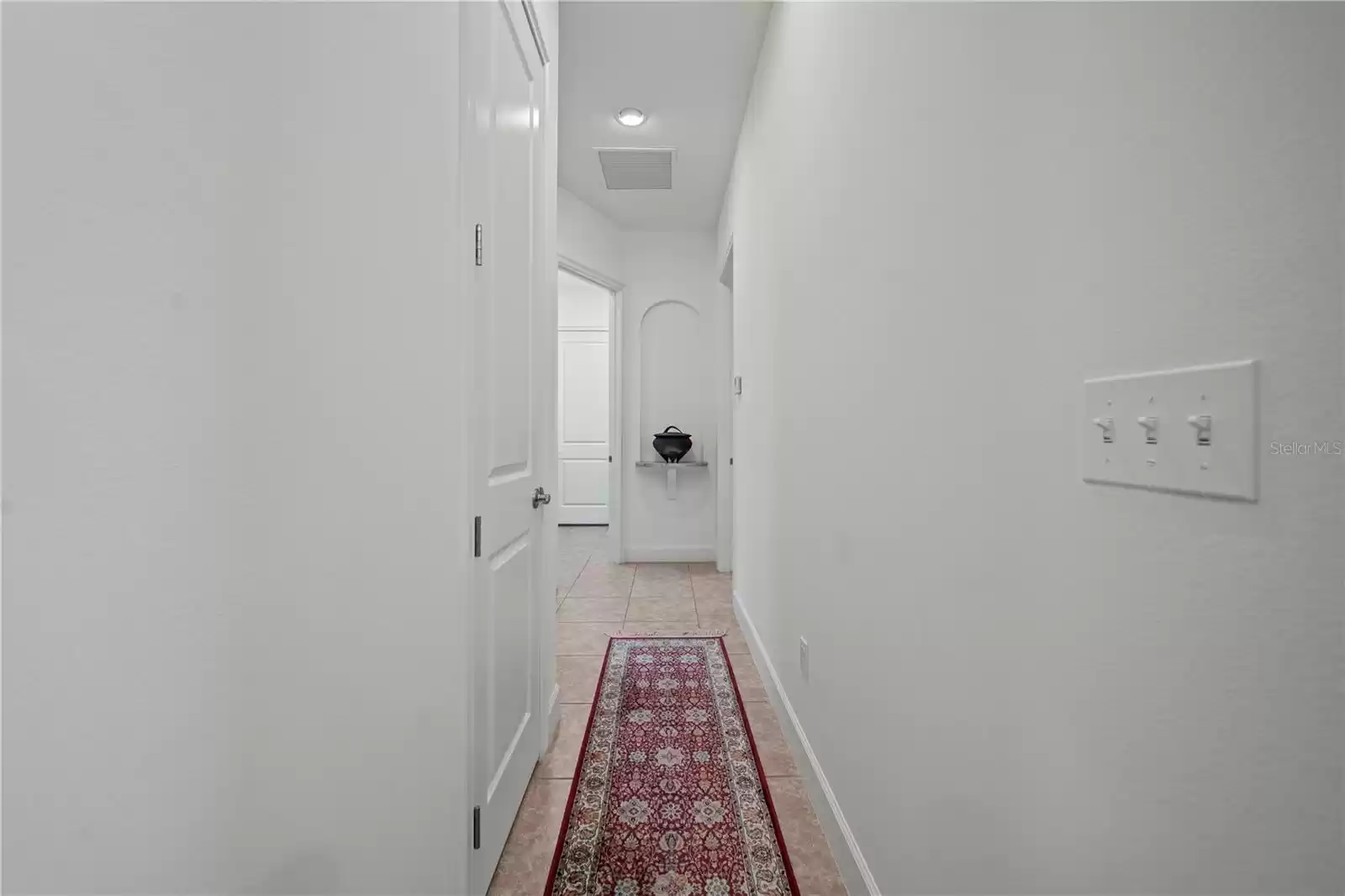 HALLWAY TO SECOND BEDROOM/BATH/LAUNDRY AND GARAGE