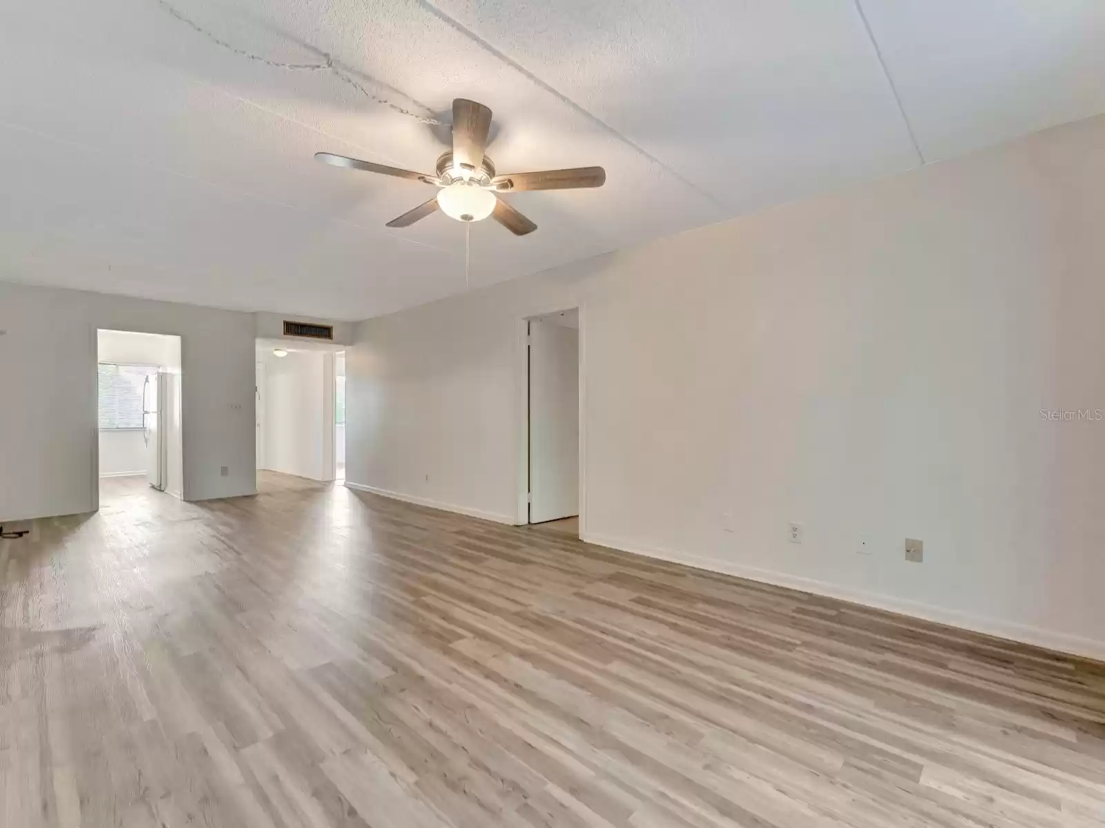 The living room, it opens up to the kitchen/dining and the entrance hallway