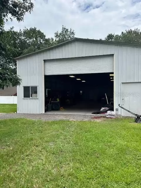 front of shop with roll up door