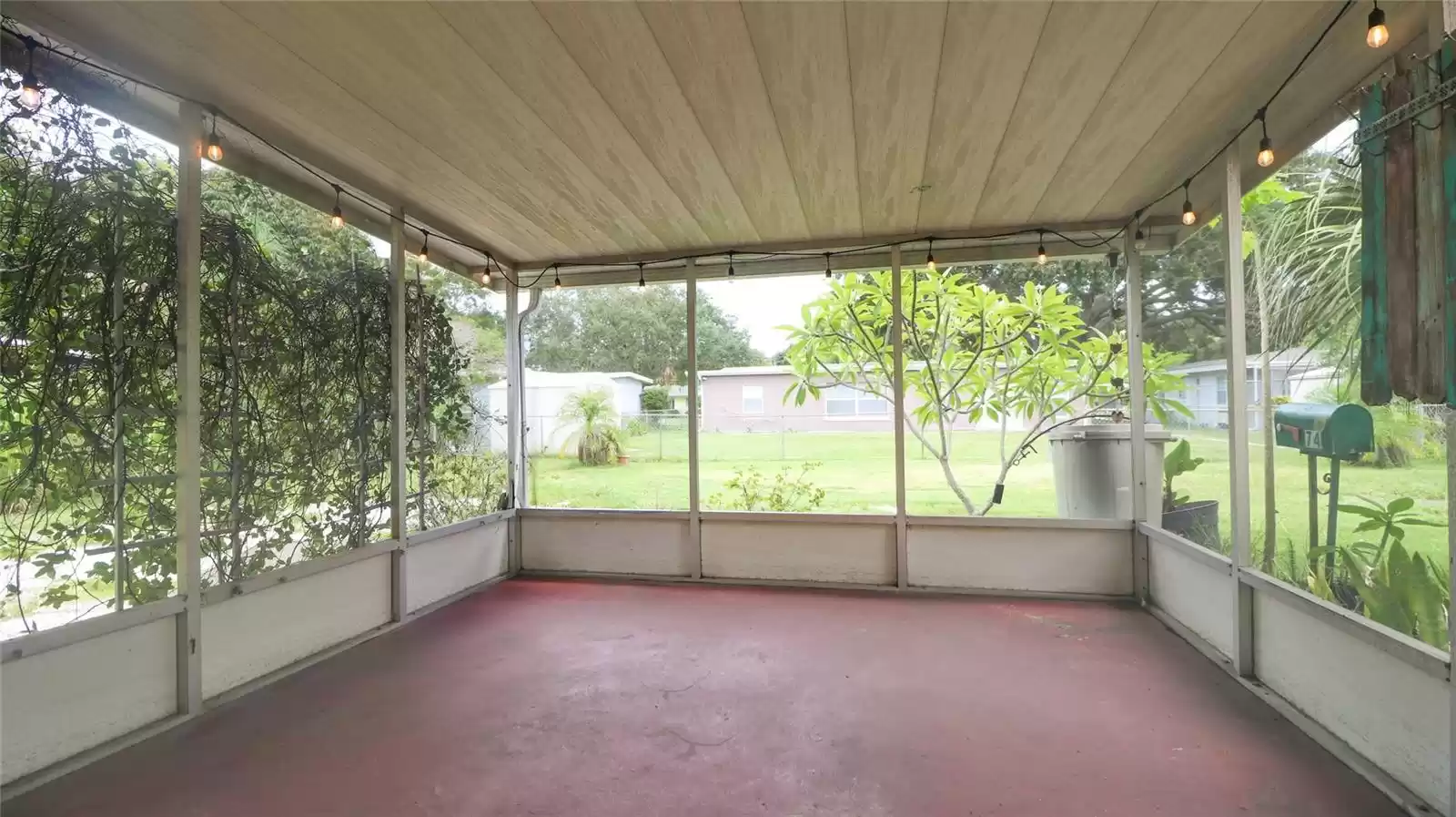 Screened lanai looking over huge yard.