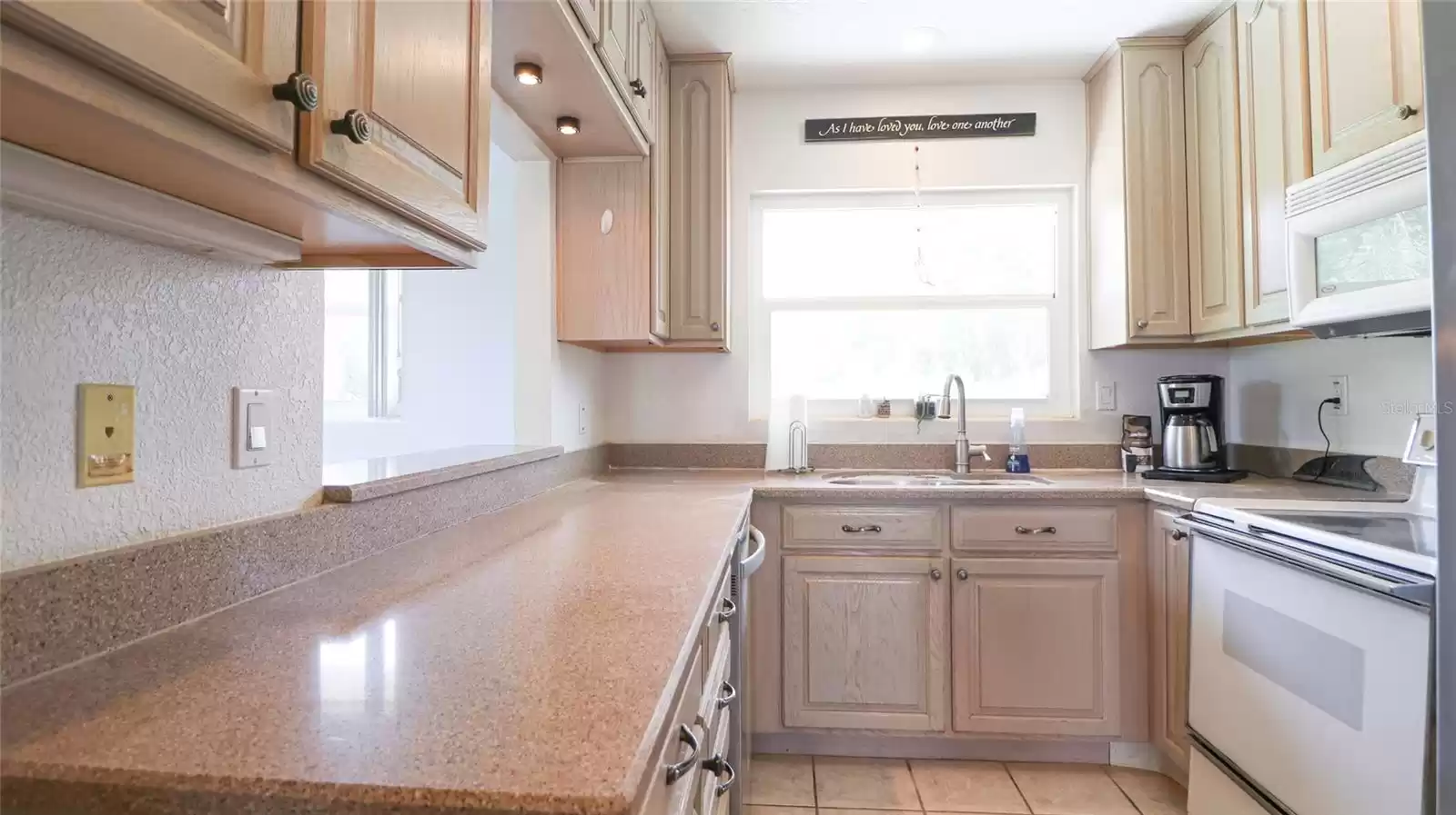 Kitchen with stone counters and wood cabinets