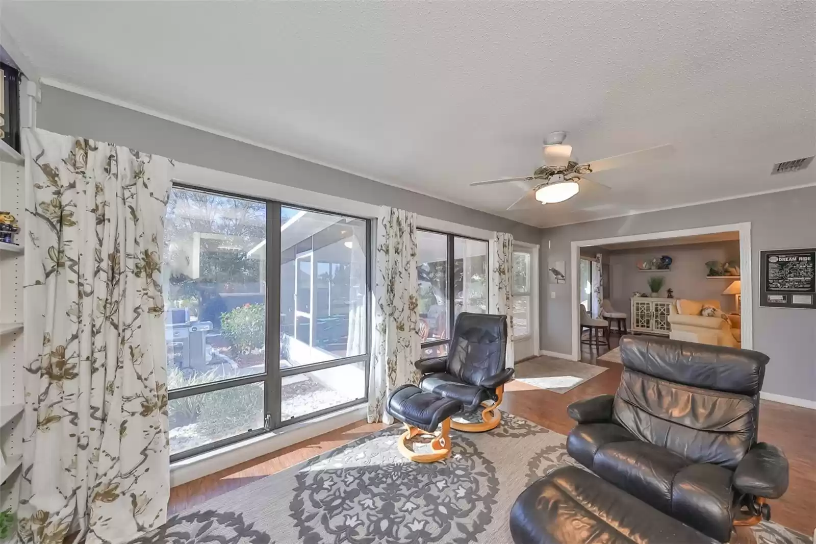 study looking out to the lanai in left and family room straight ahead